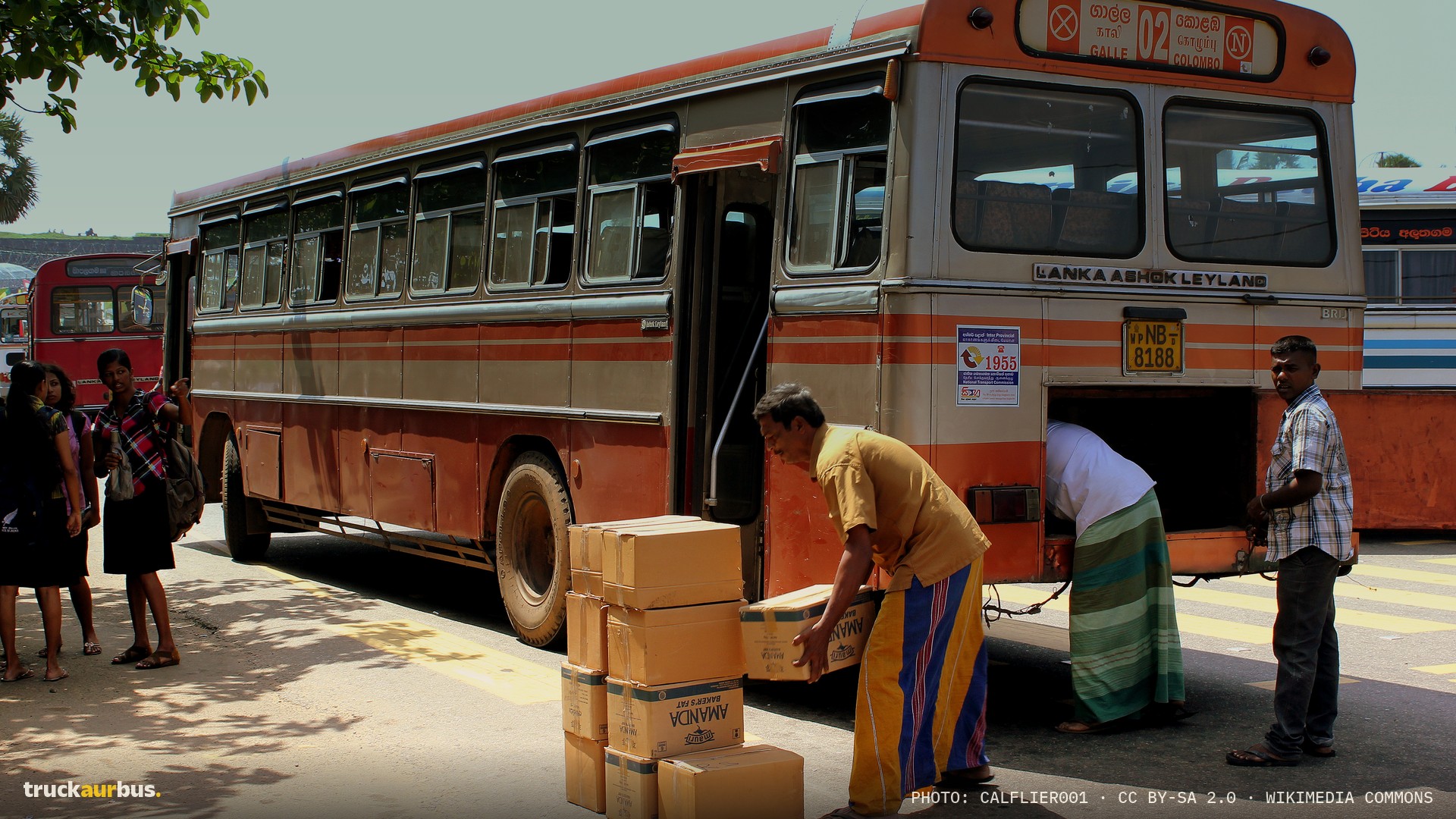 LANKA ASHOK LEYLAND BUS UNLOADS CARGO AT GALLE SRI LANKA JAN 2013