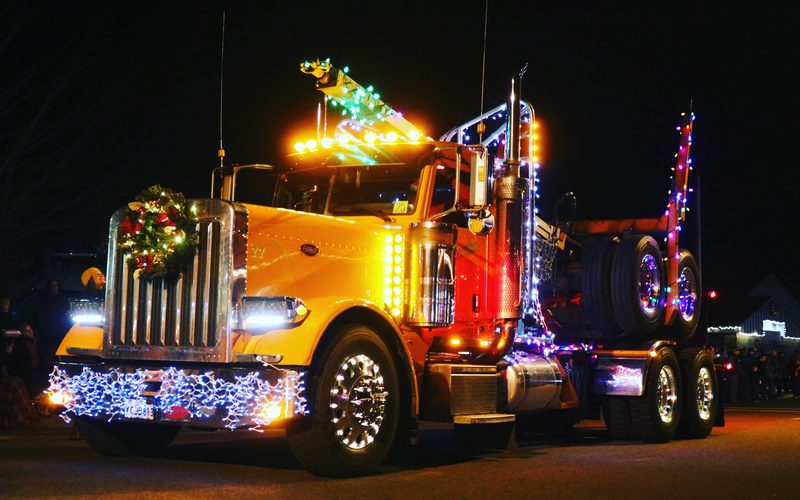 Log truck in parade, photo by Brett Williams