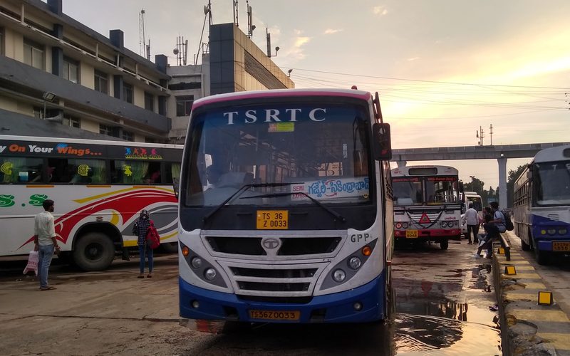 Own bus with temporary driver and conductor waiting for platform at JBS - TSRTC